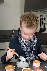 Image showing Decorating the cupcakes