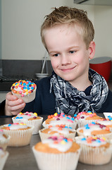 Image showing Decorating the cupcakes