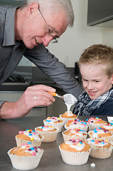 Image showing Decorating the cupcakes