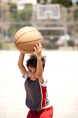 Image showing Cute young kid holding basketball