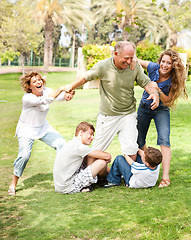 Image showing Family holding back grandfather