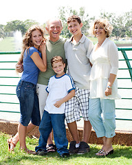 Image showing Family posing infront of lake