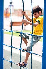 Image showing Young boy on playstructure