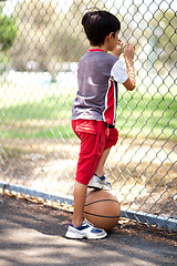 Image showing Rear view of young basketball player