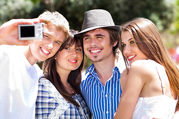 Image showing Friends taking self portrait, outdoors