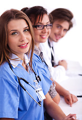 Image showing Doctors in hospital gowns in row