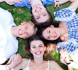 Image showing Young friends forming a circle