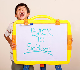 Image showing Little boy screaming with a whitebaord