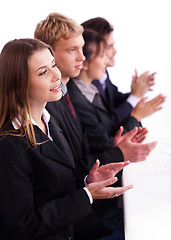 Image showing Colleagues applauding during a business meeting