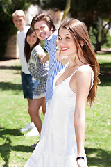 Image showing Four teens hang out in a park