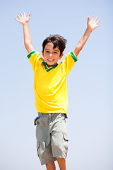 Image showing Young kid with raised arms