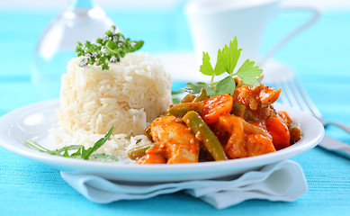 Image showing Red chicken curry stripes with rice