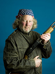 Image showing handsome middle age man leather jacket  rifle