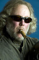 Image showing handsome middle age man leather jacket smoking cigar