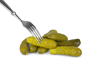 Image showing Marinated cornichones and fork