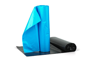 Image showing Rolls of blue and  black plastic garbage bags