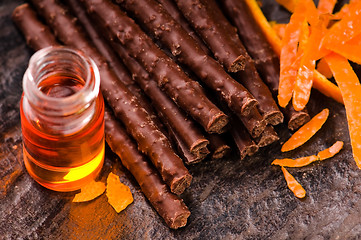 Image showing chocolate sticks with orange