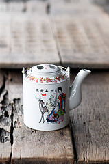 Image showing Chinese teapot on wooden table