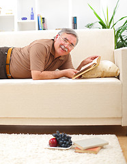 Image showing Senior man relaxing and reading