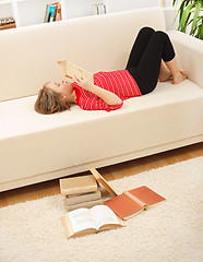 Image showing Teenager reading books