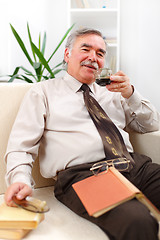 Image showing Happy senior man drinking coffee