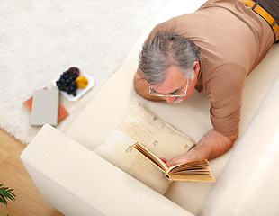 Image showing Senior man relaxing and reading