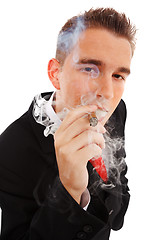 Image showing Young man in smoke cloud