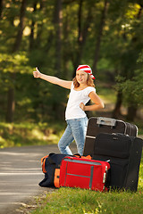 Image showing Young hitch-hiker girl