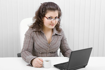 Image showing The young business woman at office