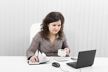 Image showing The young business woman at office