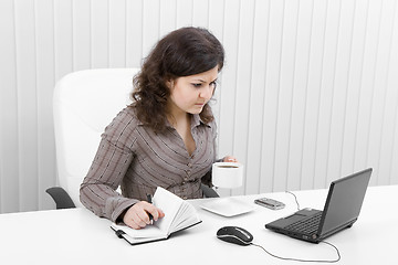 Image showing The young business woman at office