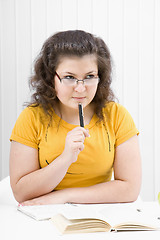 Image showing The girl the student with writing-books and books