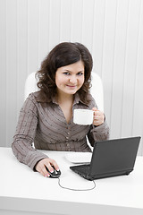 Image showing The young business woman at office