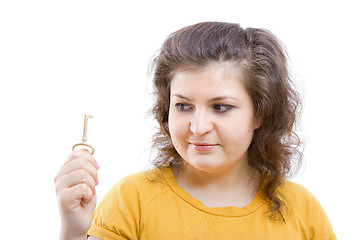 Image showing key in the hands of a young woman