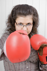 Image showing The serious girl in boxing gloves