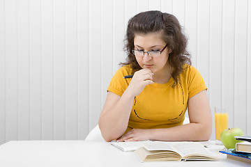 Image showing The girl the student with writing-books and books