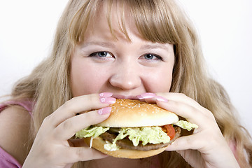 Image showing The young woman and hamburger