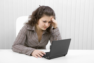 Image showing The young woman with the laptop