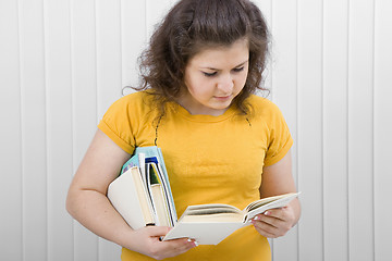 Image showing young woman reading a book