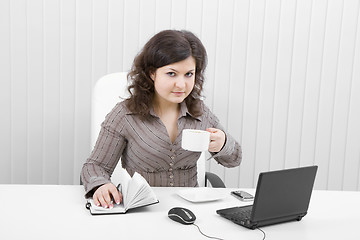 Image showing The young business woman at office