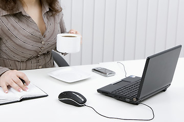 Image showing The young business woman at office