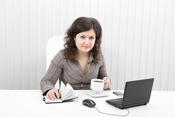 Image showing The young business woman at office