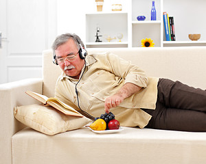 Image showing Senior man relaxing and reading