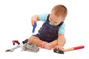 Image showing Little boy playing with tools