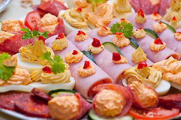 Image showing Traditional food made out of ham eggs and paste with vegetable