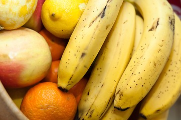 Image showing orange, banana, and otherfresh fruits in wooden dish