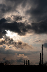 Image showing silouette of a powerplant with smoke coming out of chinney and s