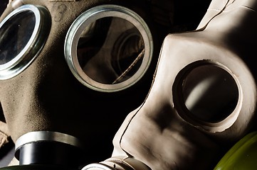 Image showing Two gasmask with focus on the grey one