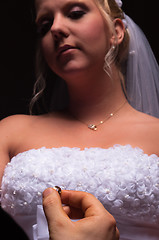 Image showing groom proposing to her bride