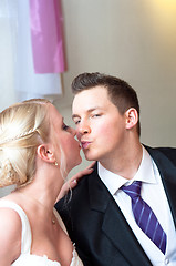 Image showing Handsome groom kissing her bride